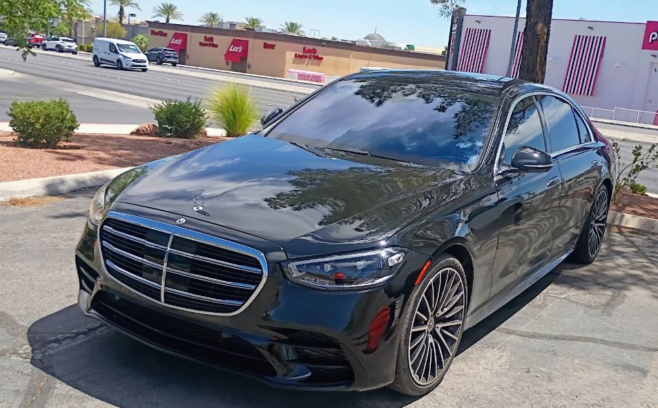 Black sedan with a glossy finish after detailing